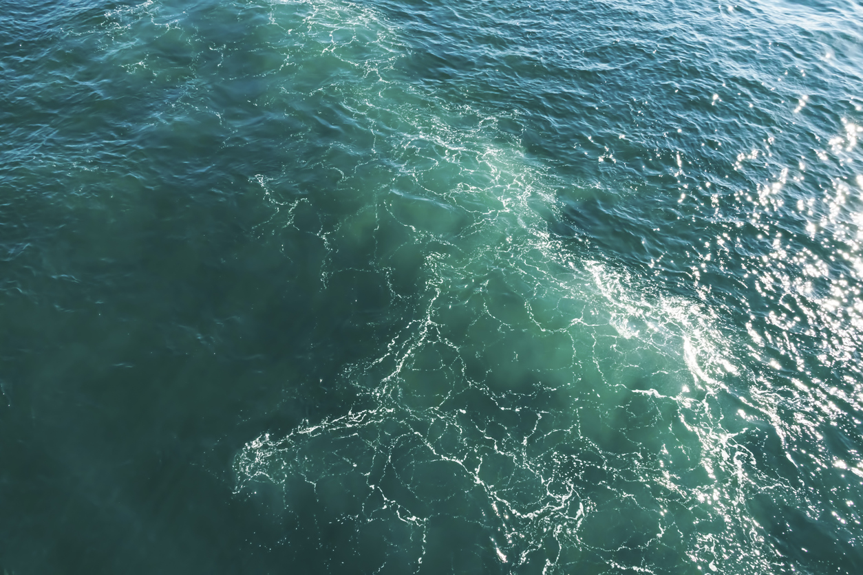 turquoise color sea and ship wave in the sea